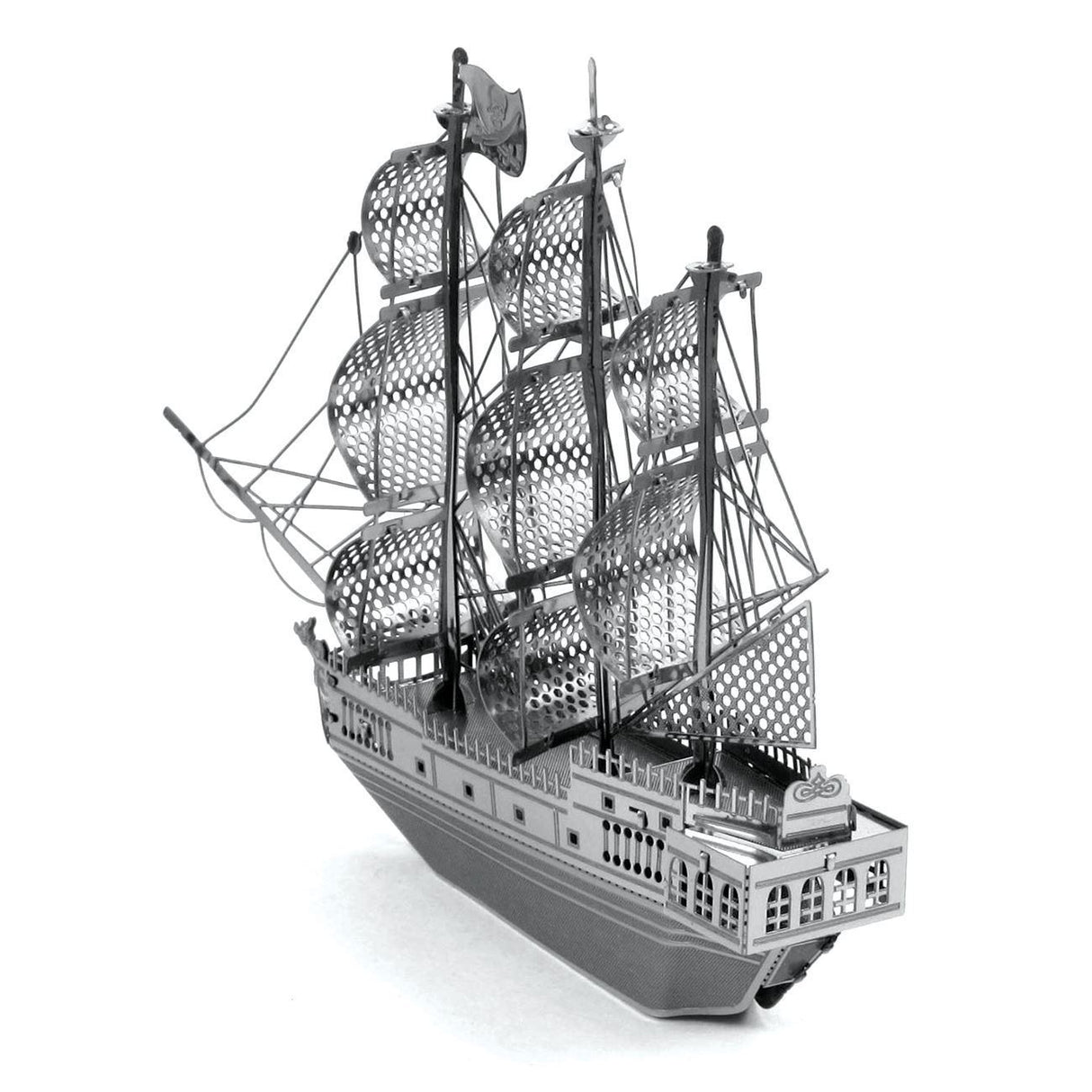 Metal model of the Black Pearl ship of a three-masted sailing ship on a white background