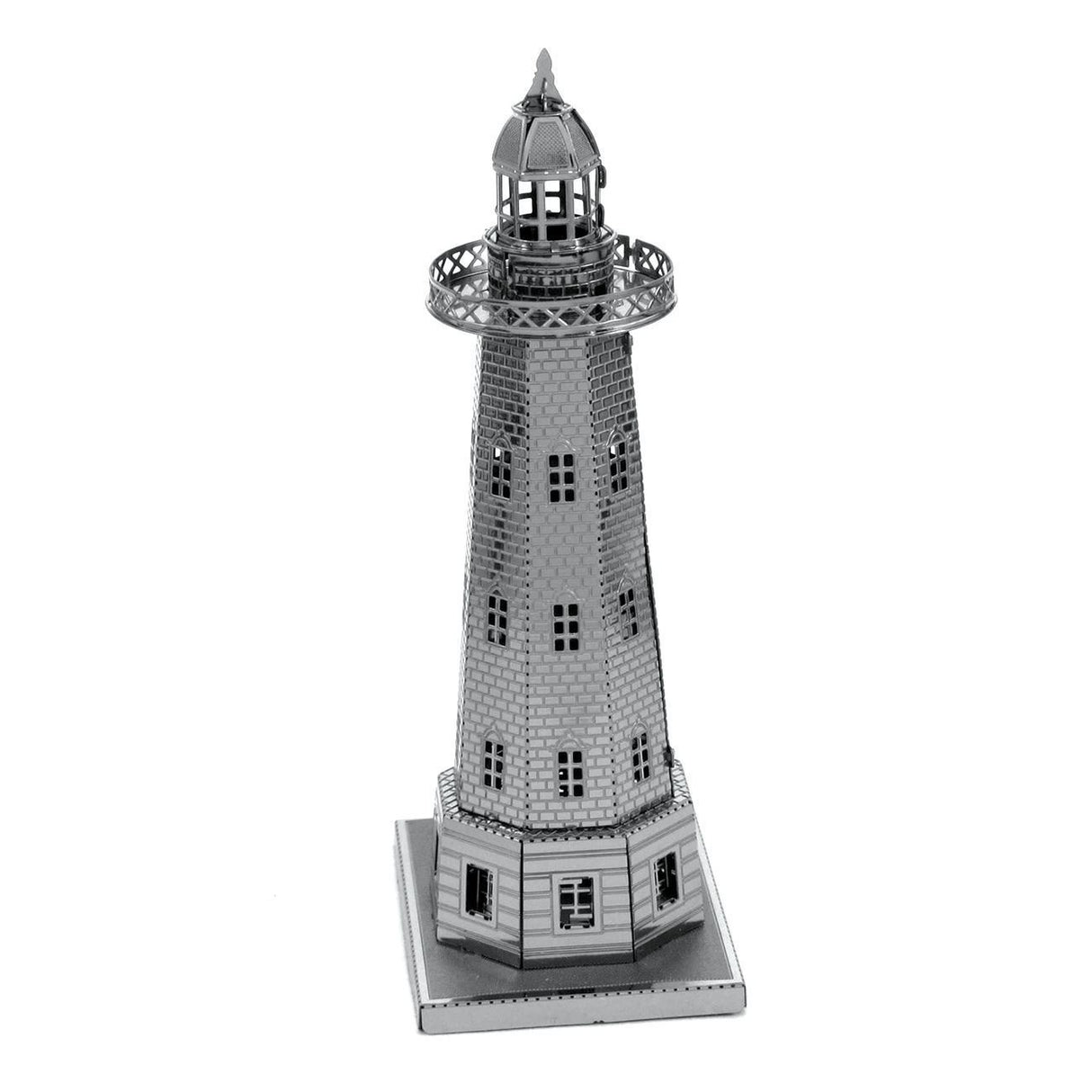 Metal model of a lighthouse on a white background