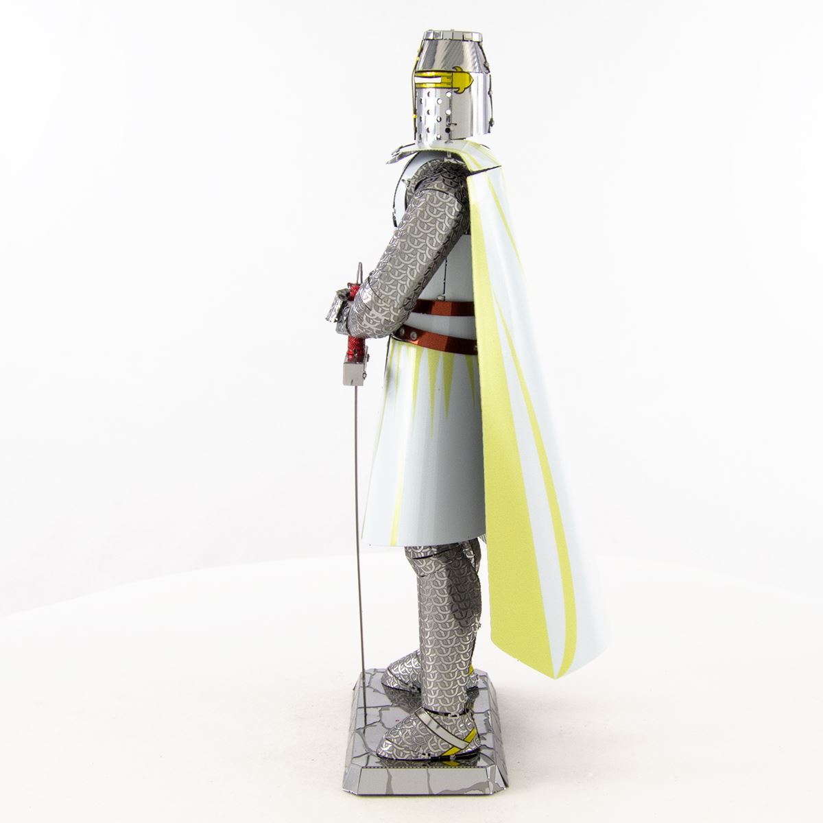 Metal Templar Knight figurine in armor with a cape on a white background