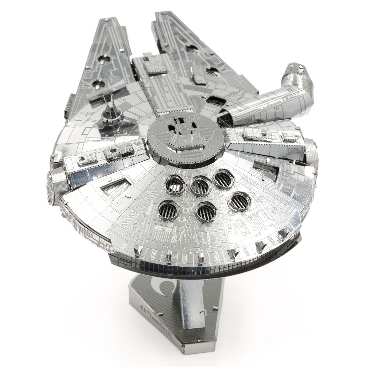 Metal model of the Millennium Falcon spaceship on a white background