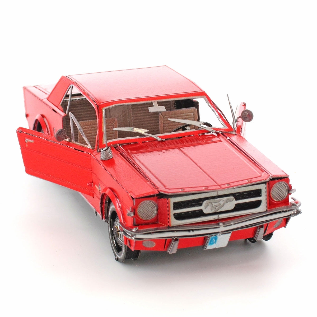 Red metal model of a 1965 Ford Mustang car on a white background