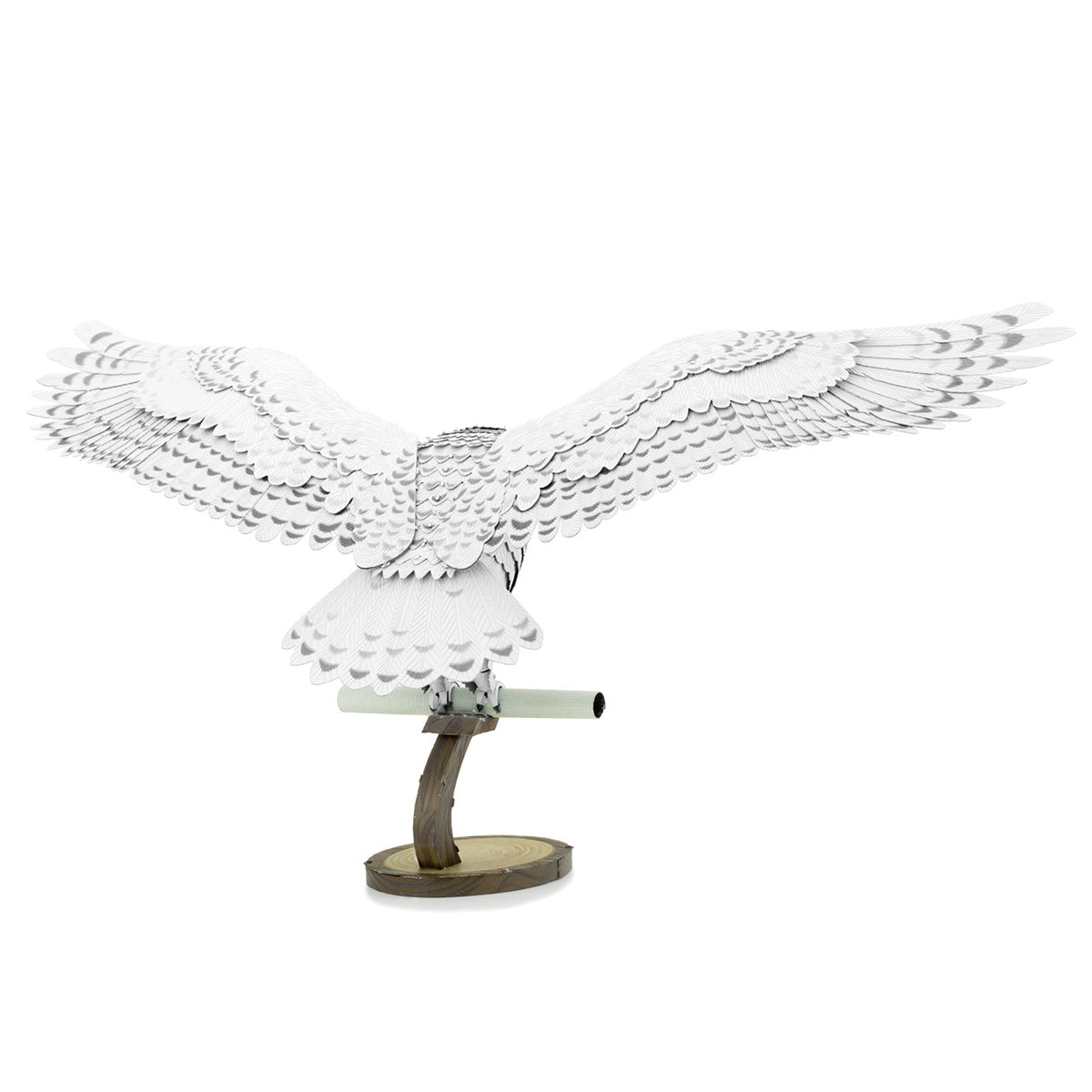 Metal model of Hedwig the owl on a white background