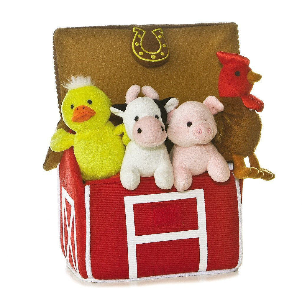 Plush farm animals in a red barn toy with a brown lid on a white background