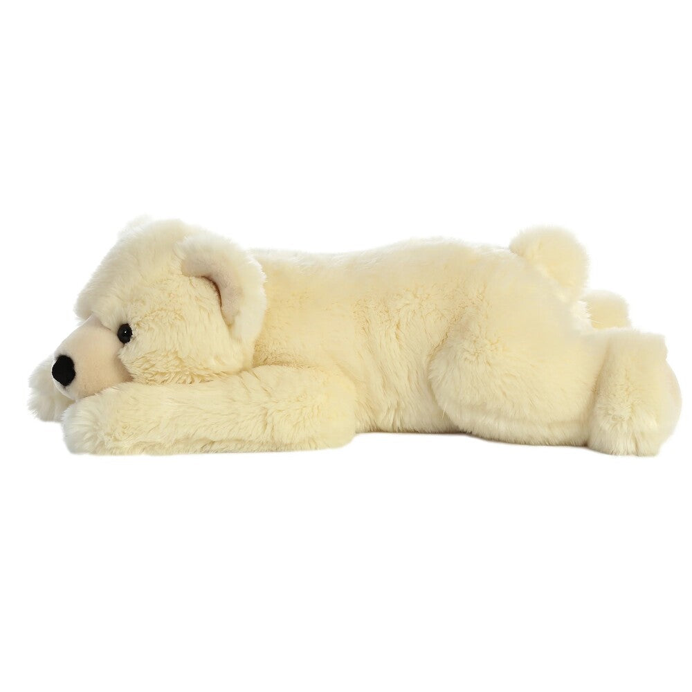 Cream-colored polar bear lying on a white background