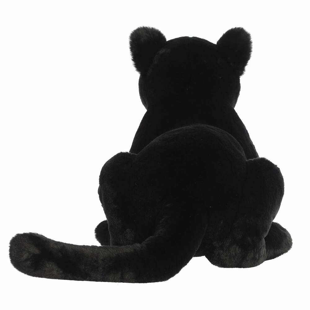 Black plush toy sitting on a white background