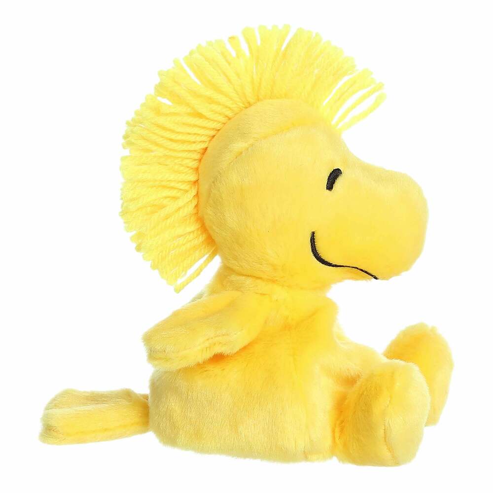 Yellow plush bird toy on a white background