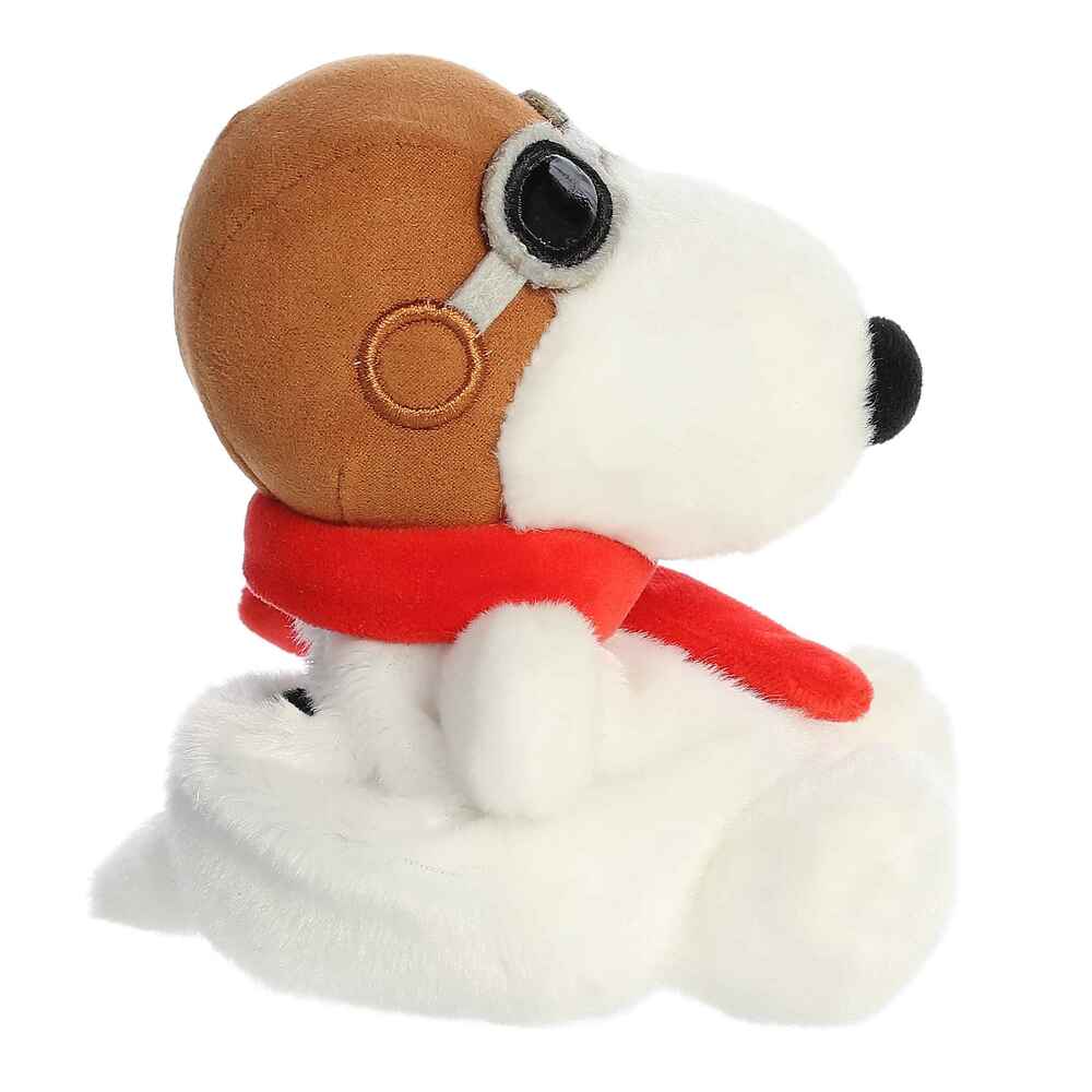 Plush dog toy with a brown helmet and red scarf on a white background