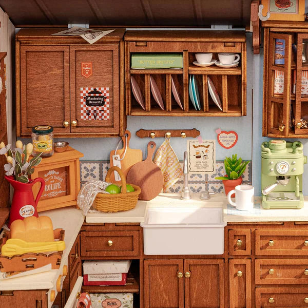 Detailed miniature Baking Kitchen with wooden cabinets, appliances, and decor.