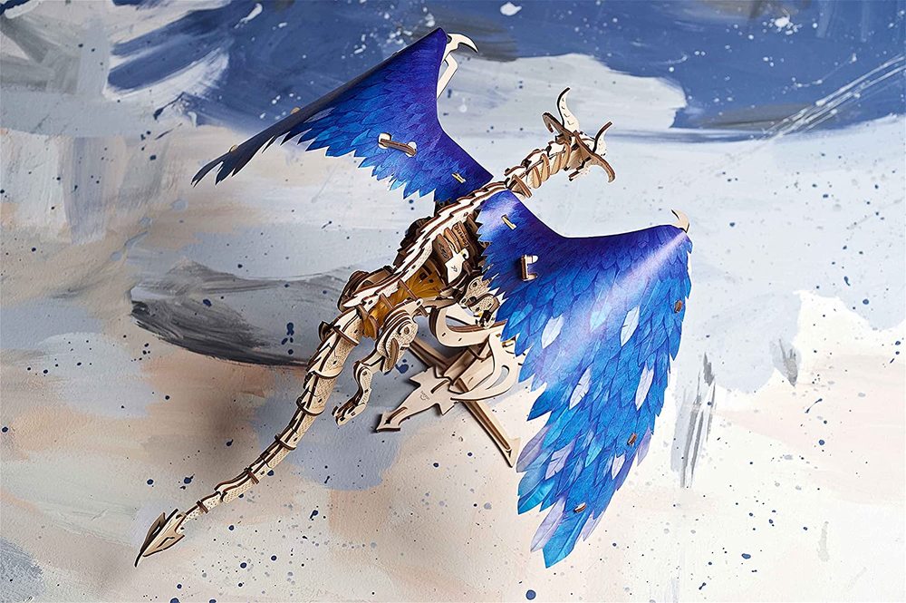 Windstorm Dragon with blue wings on a textured surface