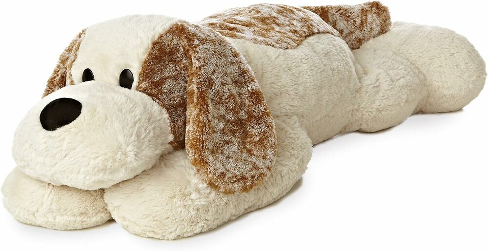 Plush dog toy with a white face and brown ears on a white background