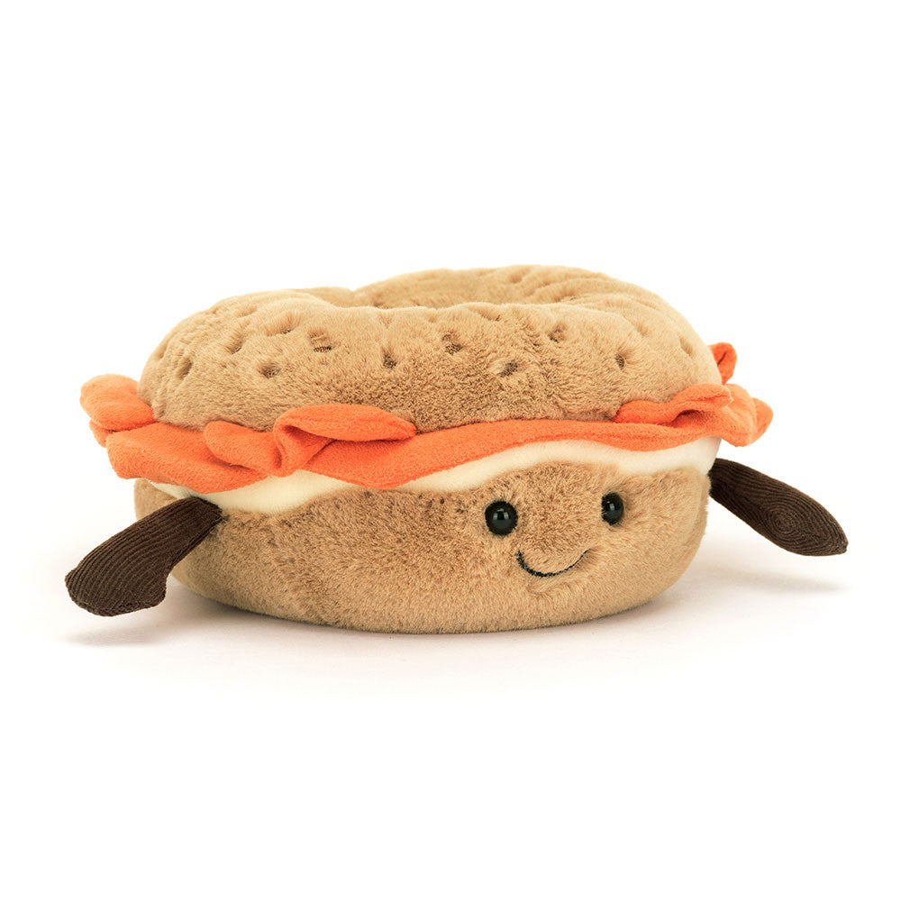 Plush Amuseables Bagel toy with a smiling face on a white background
