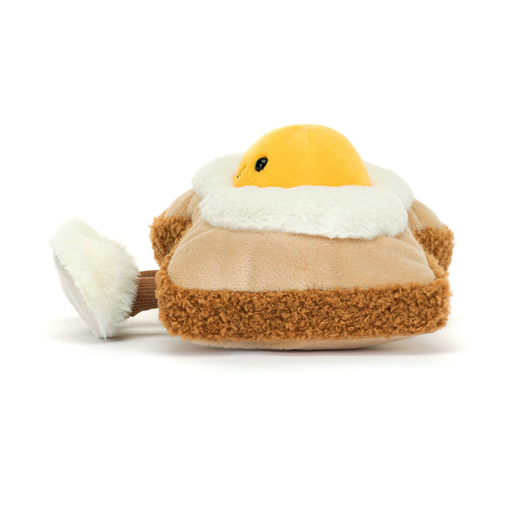 Side view of a plush toy Amuseables Egglantine Egg On Toast on a white background