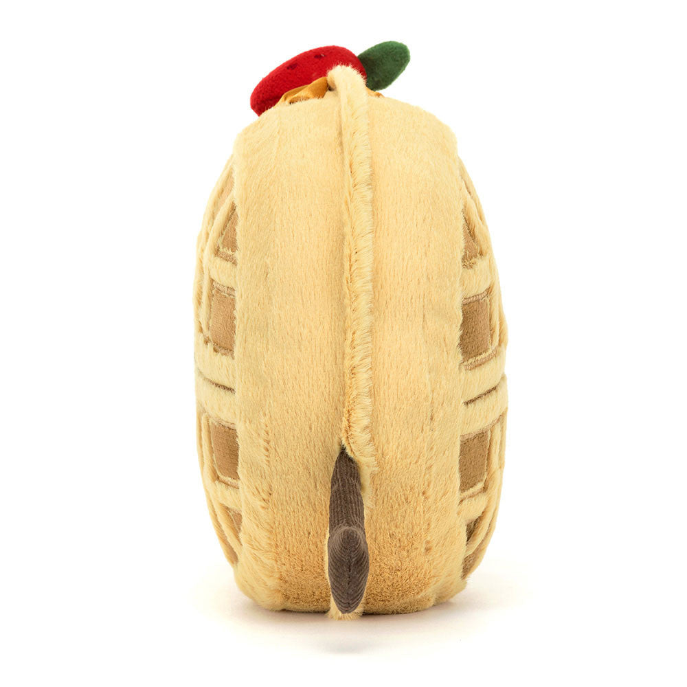 Side view of a soft, plush toy designed as a waffle with a red strawberry on top, named Amuseables Rene Waffle, perfect for kid's birthday gifts.