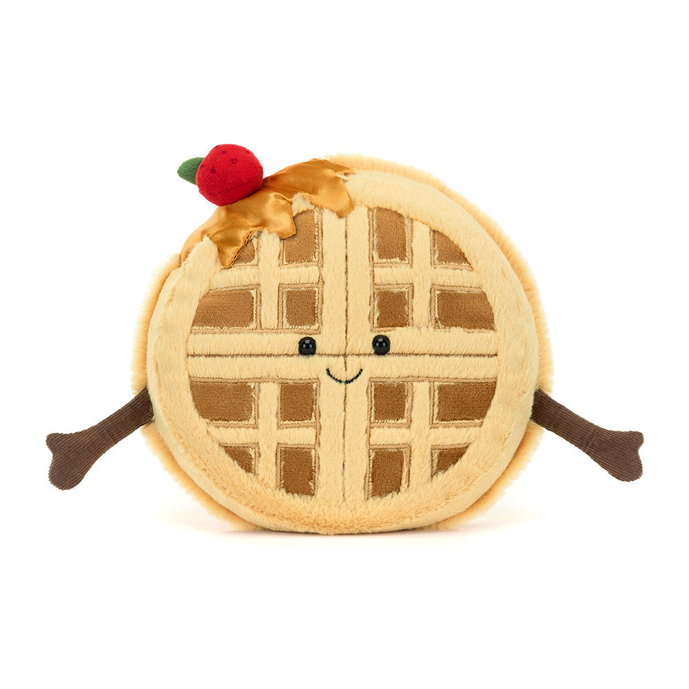 Soft plush toy shaped like a smiling waffle with arms, topped with syrup and a red cherry, designed as the Amuseables Rene Waffle for kids and toddler play.