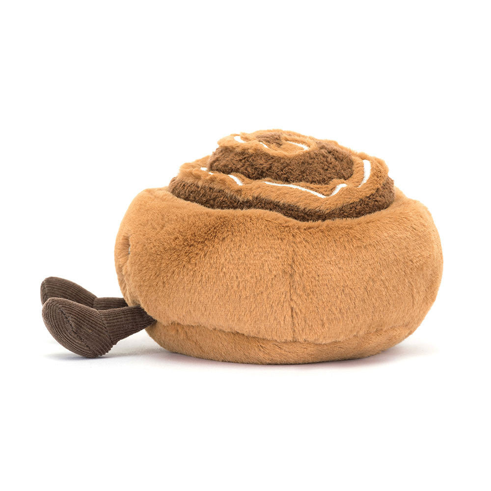 Side view of a plush Amuseables Cinnamon Bun toy on a white background