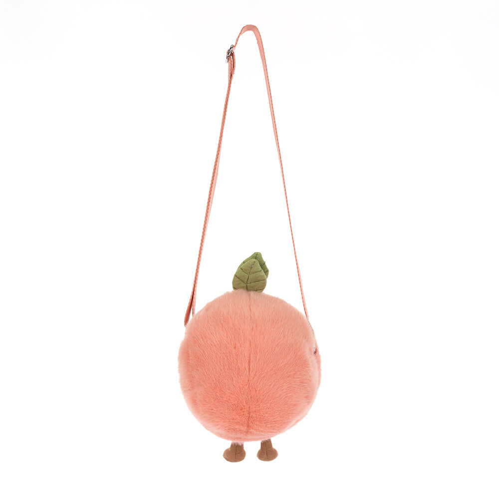 Amuseables Peach Shoulder Bag features a soft, round peach-shaped design with a long adjustable strap, green leaf detail, and cute small feet at the bottom.