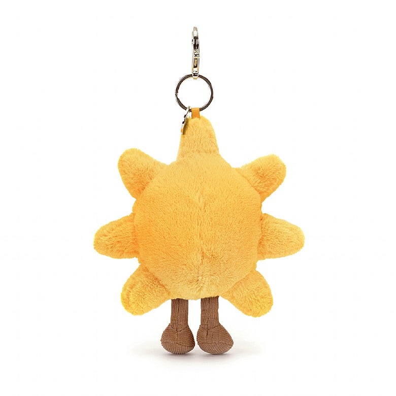 Amuseables Sun Bag Charm is a soft yellow sun-shaped plush keychain with small legs and a metal clip for attaching to bags or keys.
