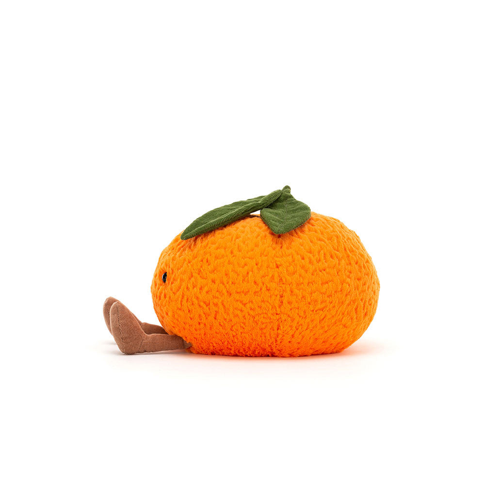 Amuseables Clementine is a soft, orange plush toy shaped like a clementine fruit with small fabric legs and green leaves on top, designed as a cute stuffed toy.