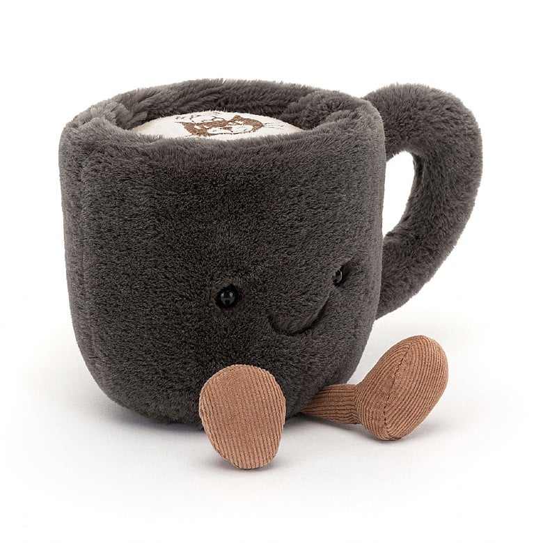 A soft, plush Amuseables Coffee Cup toy with a smiling face and small brown fabric feet, designed as a cute and cuddly stuffed companion.