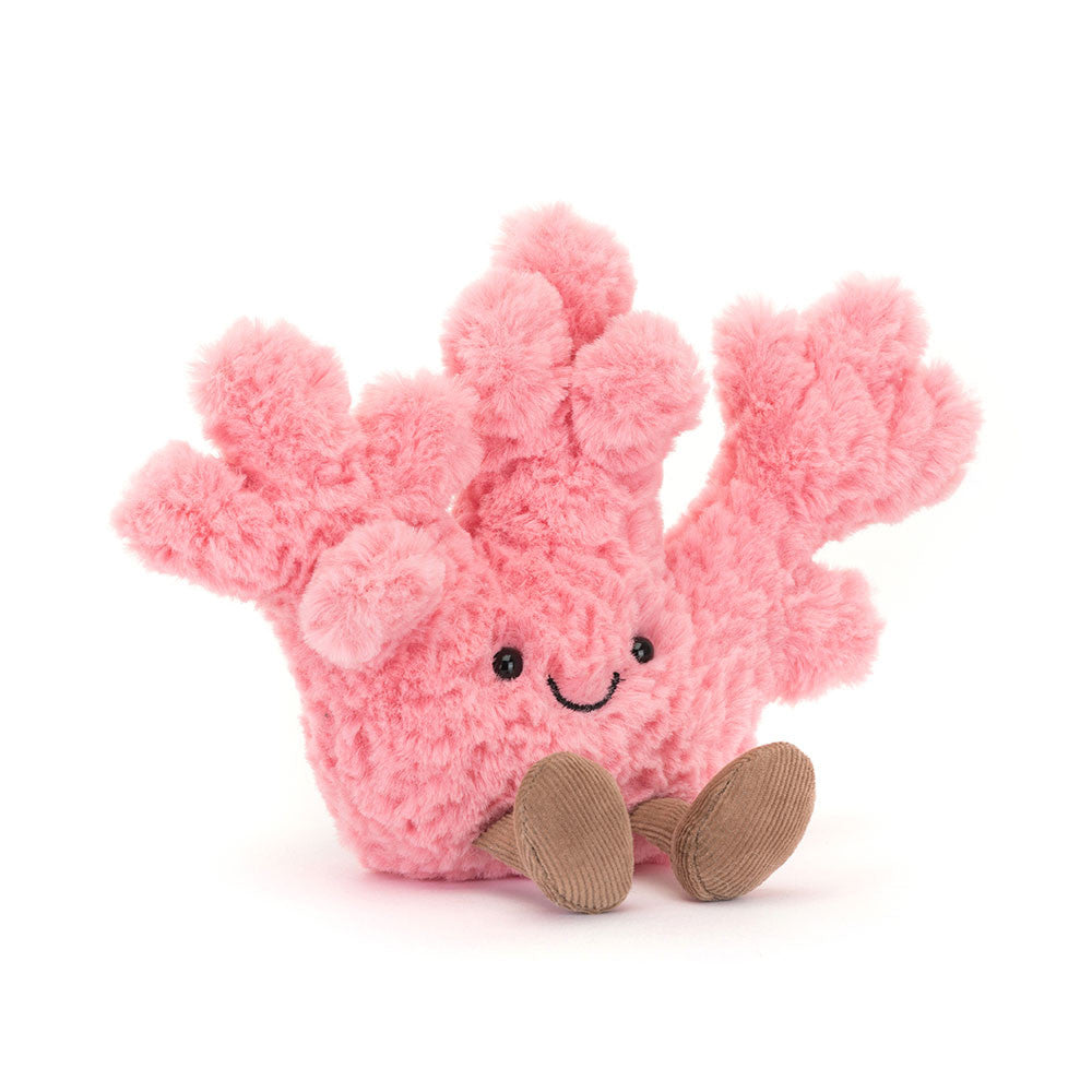 Pink plush Amuseables Coral toy with a smiling face on a white background