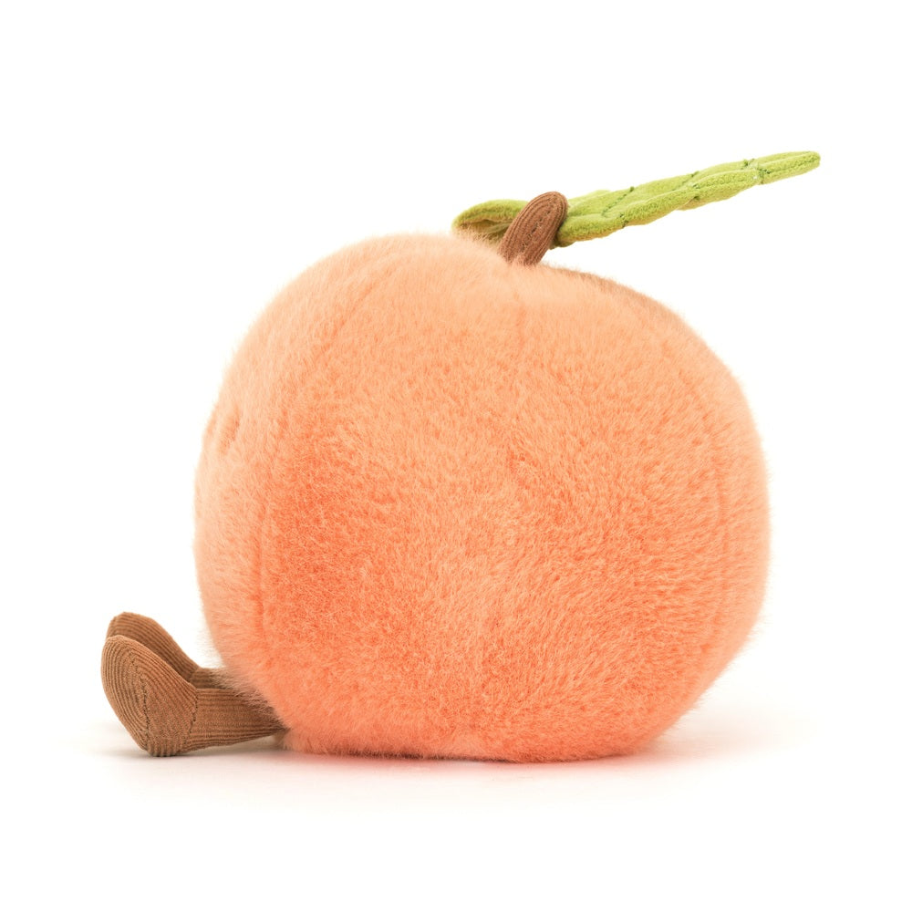Soft, round plush toy resembling a peach with a green leaf and a brown stem, featuring a small fabric legs attached, called Amuseables Peach.