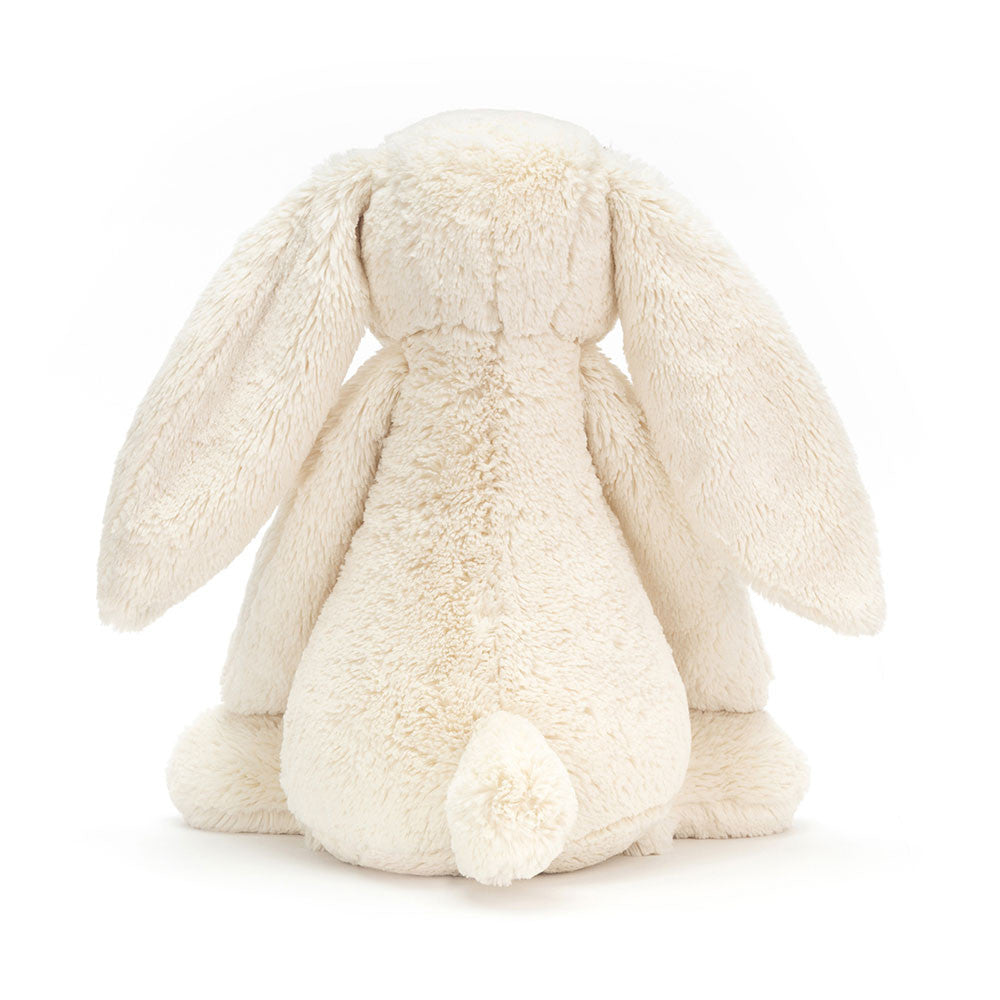 Bashful Cream Bunny Huge plush toy shown from the back, featuring soft cream-colored fur, long floppy ears, and a small round tail, perfect as a cuddly toddler toy.
