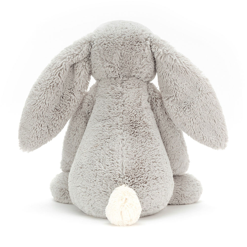 Soft gray plush bunny with long floppy ears and a white fluffy tail, shown from the back, representing the Bashful Silver Bunny Really Big stuffed animal.