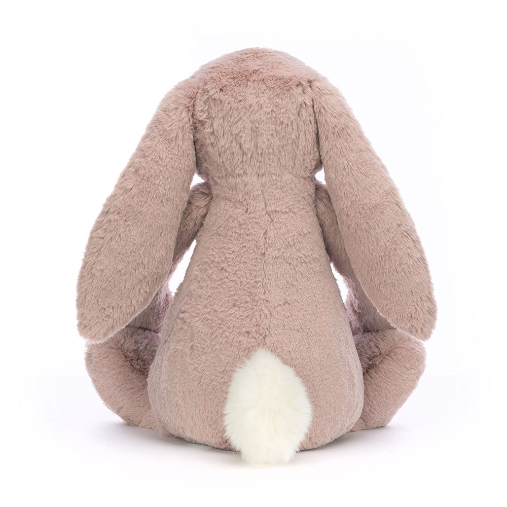 Bashful Luxe Bunny Rosa Huge plush toy shown from the back, featuring soft pink fur, long floppy ears, and a fluffy white tail, perfect as a cuddly stuffed animal gift.