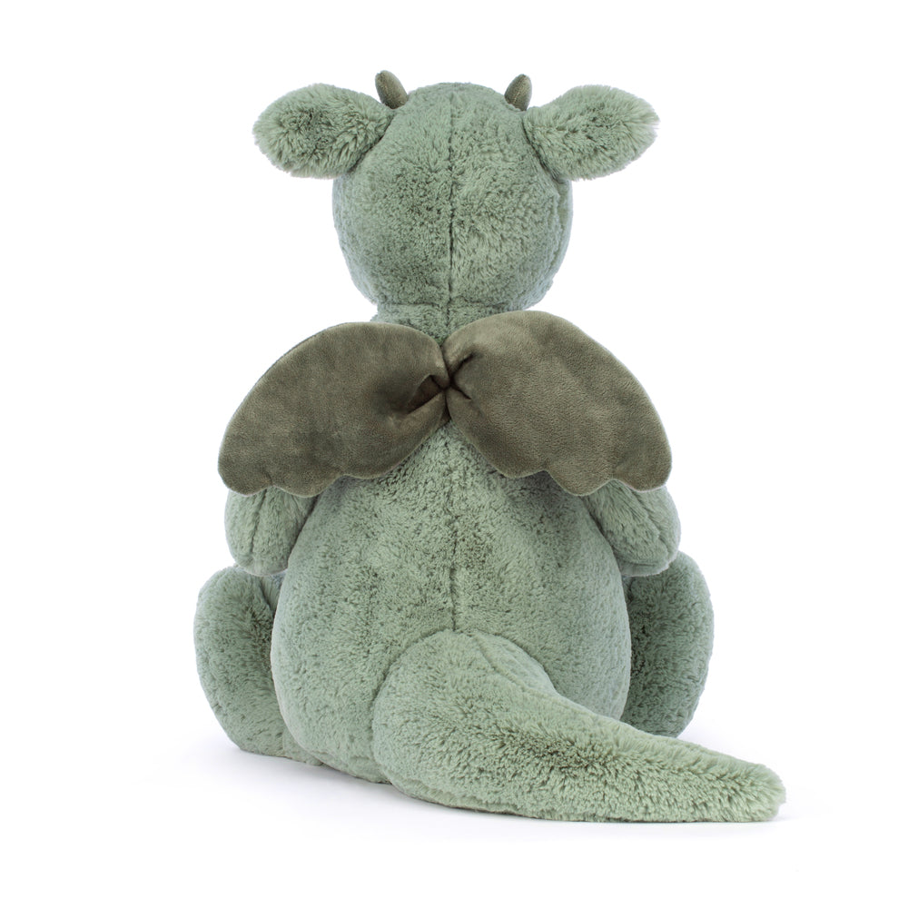 Soft green plush toy dragon with large wings and rounded ears sitting facing away, called Bashful Dragon Really Big, perfect as a kid's stuffed animal gift.