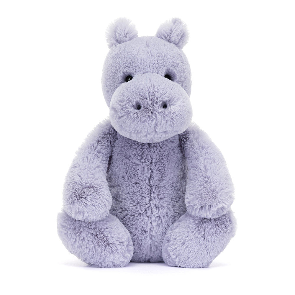 Soft lavender plush toy in the shape of a friendly hippo with round eyes and a large snout, designed as the Bashful Hippo for cuddly comfort and play.