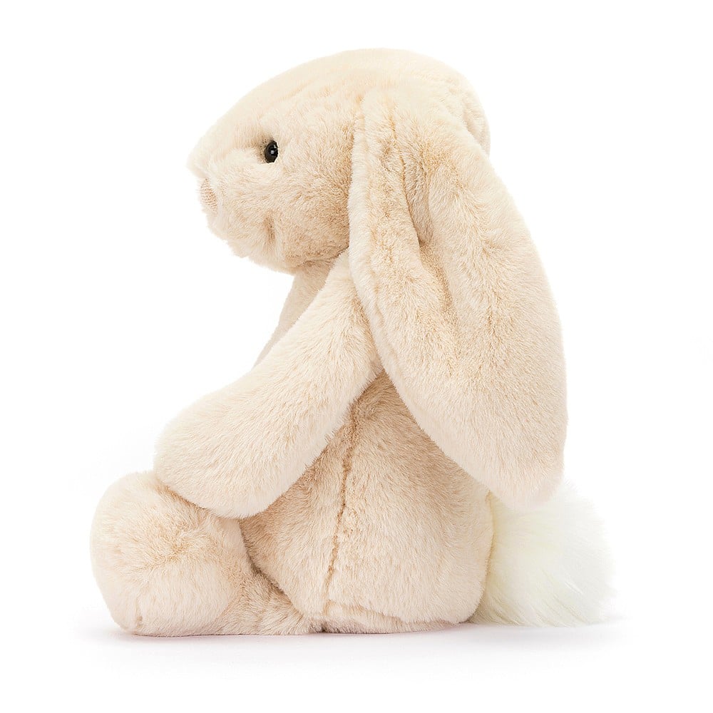 Soft plush beige bunny with long floppy ears and a fluffy tail sitting upright, a perfect cuddly companion named Bashful Luxe Bunny Willow Medium.