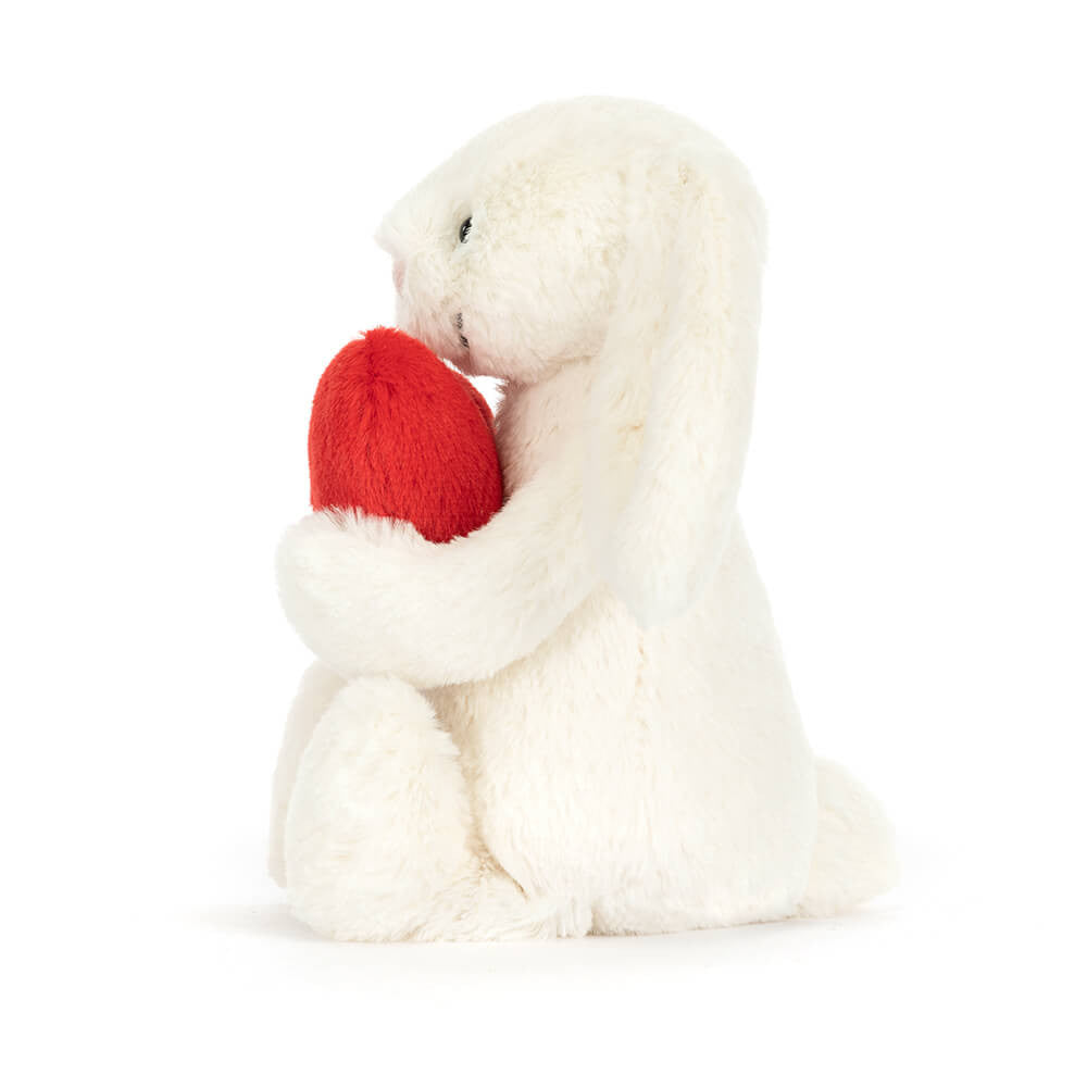 Soft white plush Bashful Red Love Heart Bunny cuddling a bright red heart, perfect as a charming stuffed animal gift for kids and toddlers.
