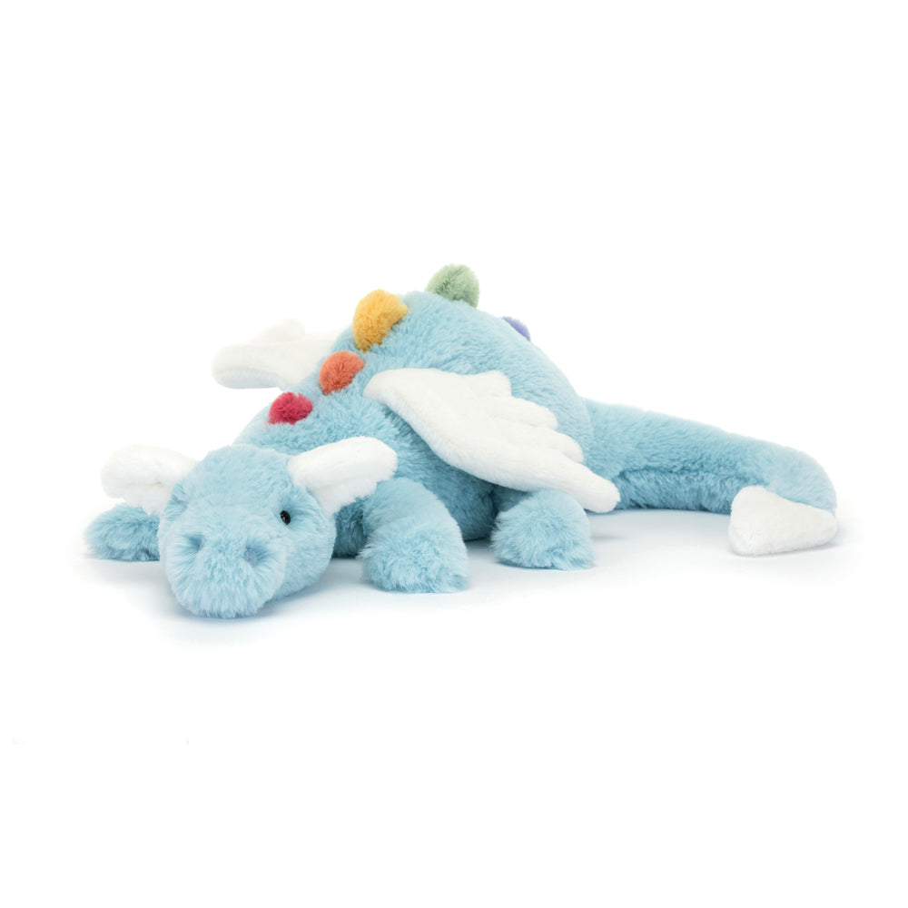 Soft light blue plush dragon toy with white wings and colorful fabric spikes lying down, designed as Sky Dragon Large for children's play and comfort.