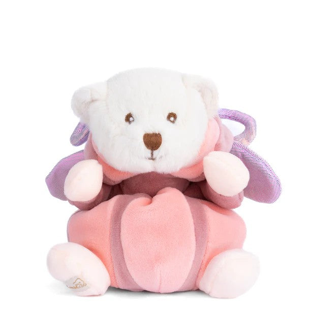 Plush toy bear in a pink butterfly costume with horns on a white background