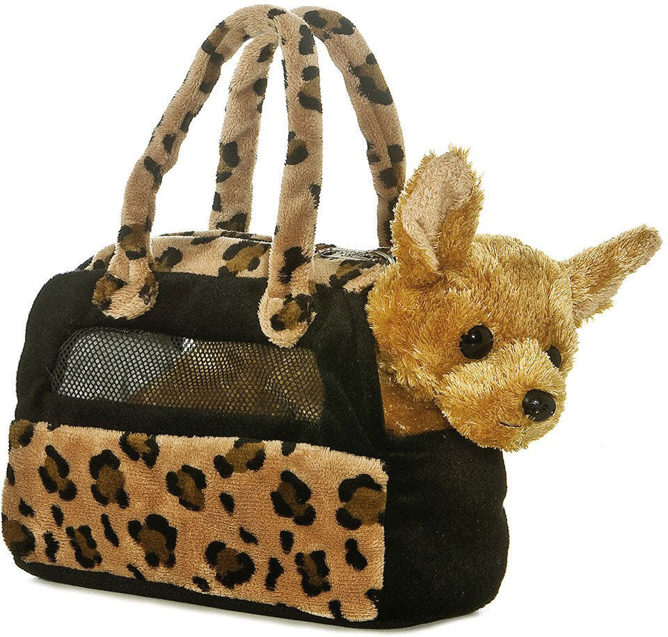 Pet carrier with leopard print design and a plush toy dog inside on a white background