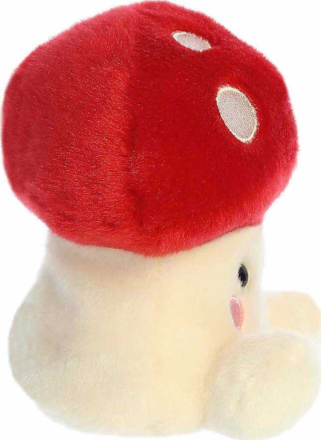 Plush toy red mushroom on a white background