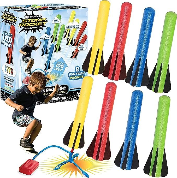 Colorful Stomp Rocket® Jr. Rockets with 8 foam rockets with packaging and a child playing with one of them.