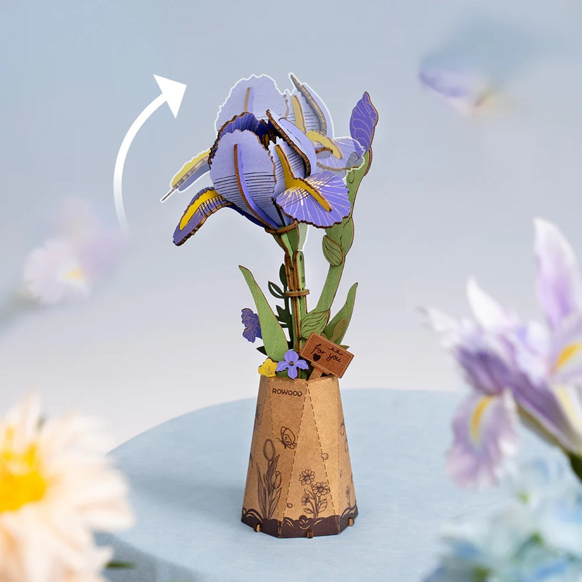 Purple Iris DIY Wooden Flower 3D Puzzle of an iris plant with a cardboard vase on a light blue background.