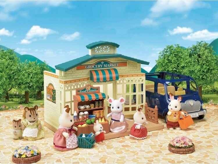 Toy grocery market set with animals and a car on a scenic background