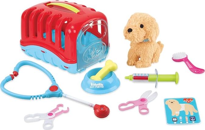Toy veterinarian set with red pet carrier, stuffed dog , and various veterinary tools on a white background