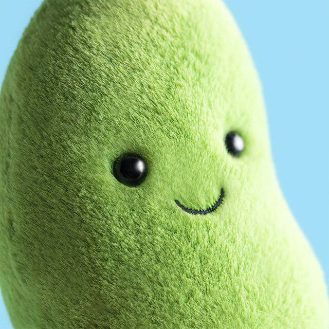 Plush Amuseables Soyella Edamame Bean toy with a smiling face against a blue background