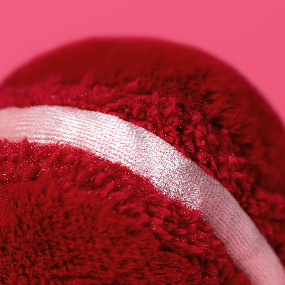Close-up of Amuseables Arlette Red Heart Macaron with white stripe on pink background