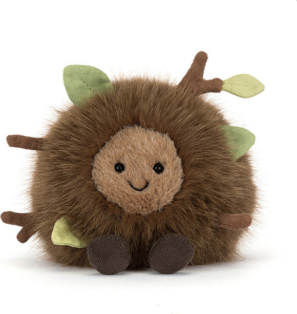 A plush Amuseables Mulshi Woodland Floor toy with brown faux fur, a tan face, green leaves, and brown branches, photographed on a clean white background.