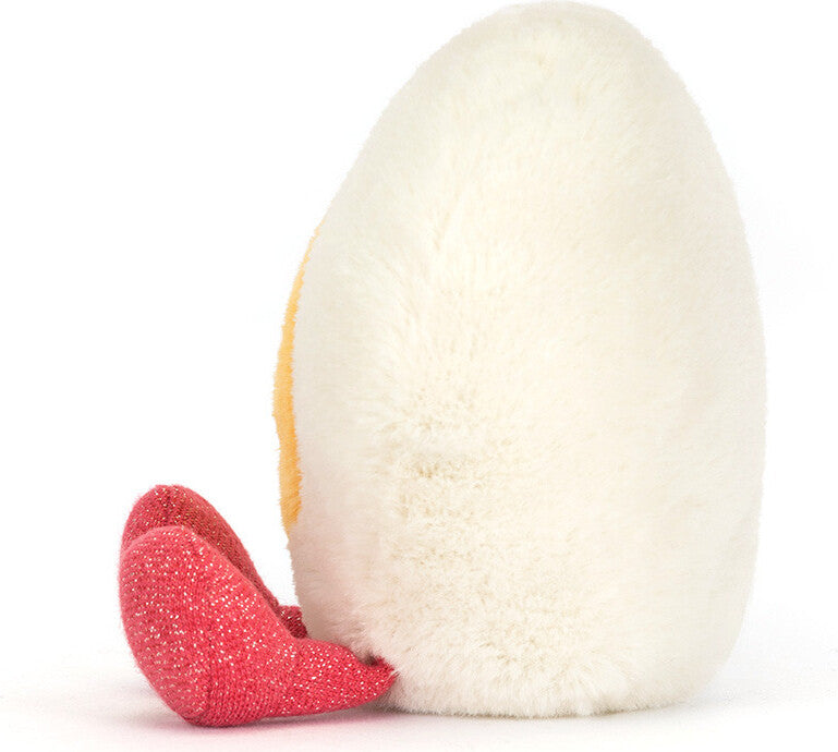 Soft plush shaped like a white boiled egg with a red heart-shaped accessory beside it, designed as the Amuseables Heart Boiled Egg plush toy.
