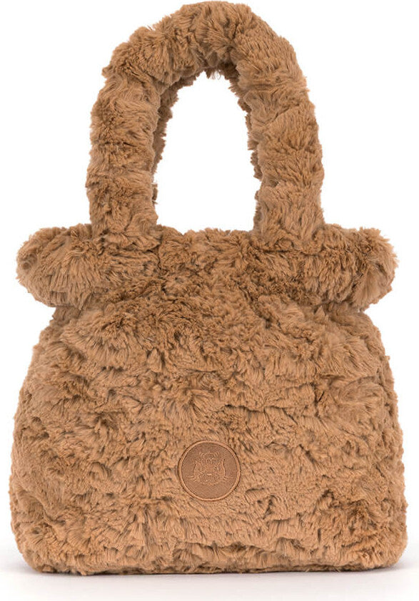 A plush, shaggy brown Bartholomew Bear Handbag with double top handles and a circular brown leather logo patch on the front, set against a plain white background.