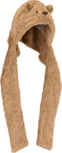 A plush Bartholomew Bear Bundlesnug hooded scarf in a warm tan-brown color, featuring embroidered bear eyes and nose on the hood and long hanging ear flaps, shown against a plain white background.