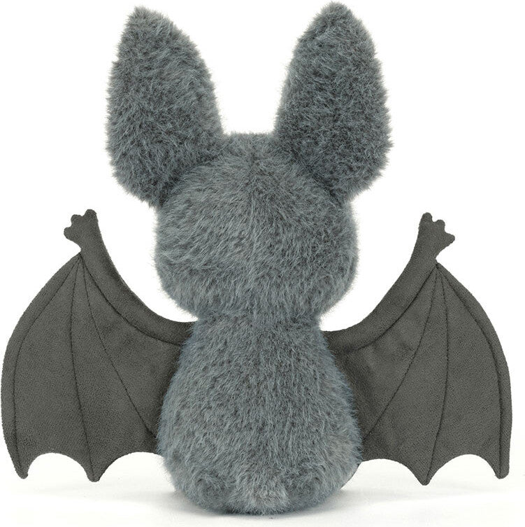 Plush toy Broox Bat with gray fur and black wings on a white background
