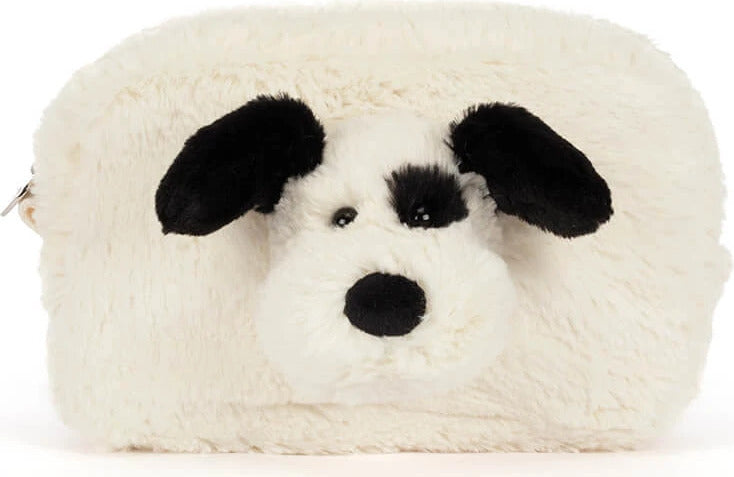 A fluffy faux-fur Rufferty Puppy Pouch shaped like a dog head, with black ears, black eyes, and a black nose on an off-white background.