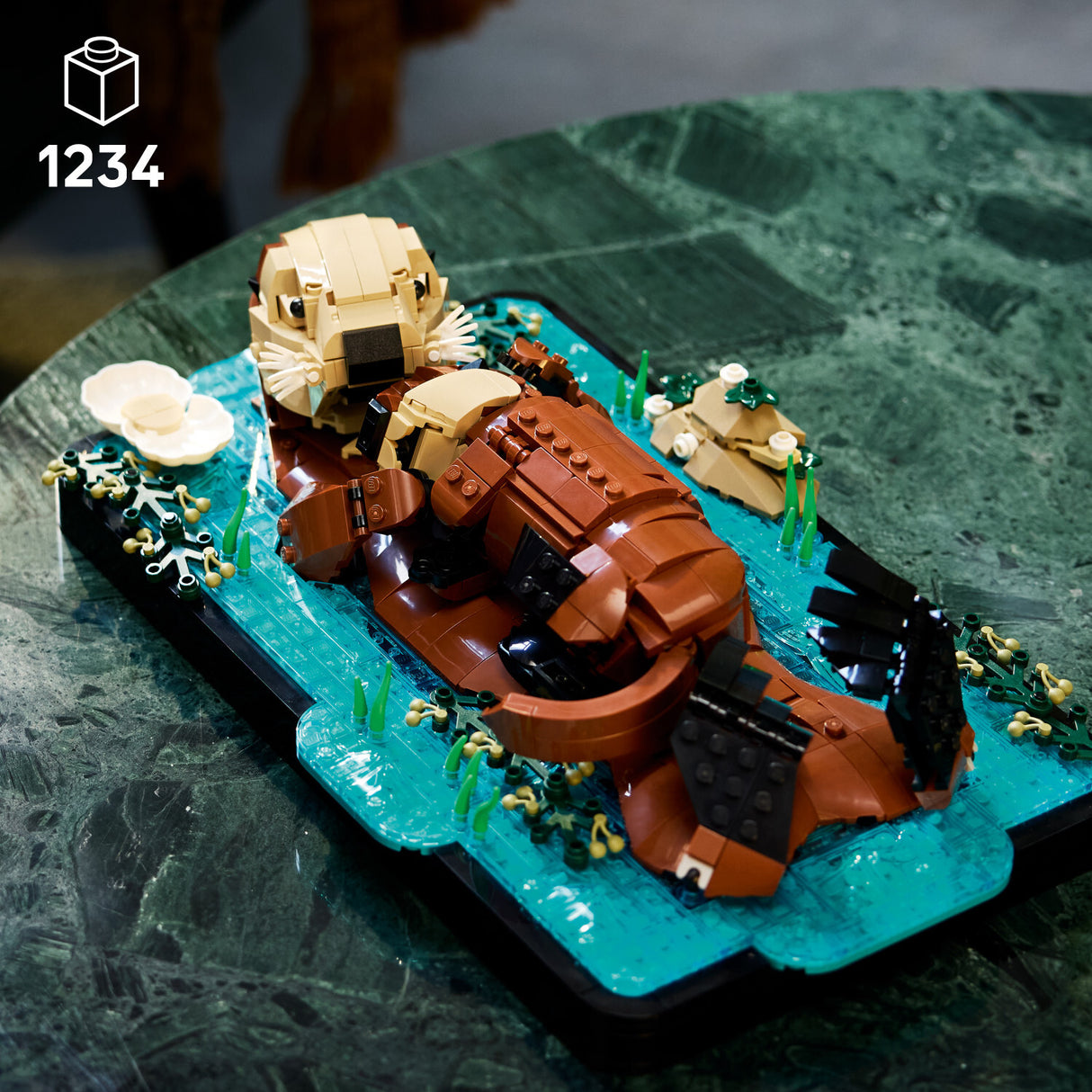 LEGO Ideas: Floating Sea Otters on a green baseplate with water and plants