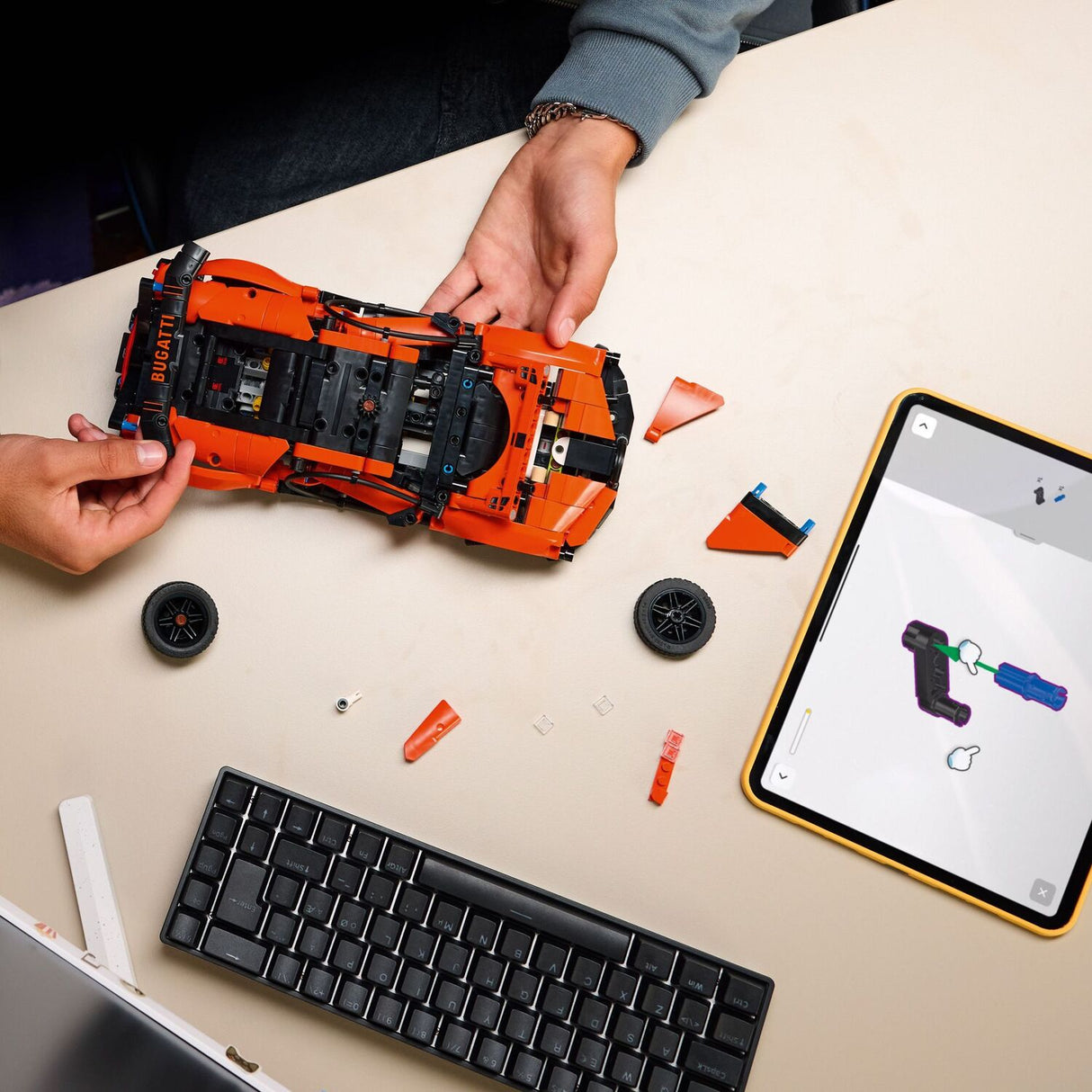 Person building a LEGO Technic: Bugatti Chiron Pur Sport Hypercar